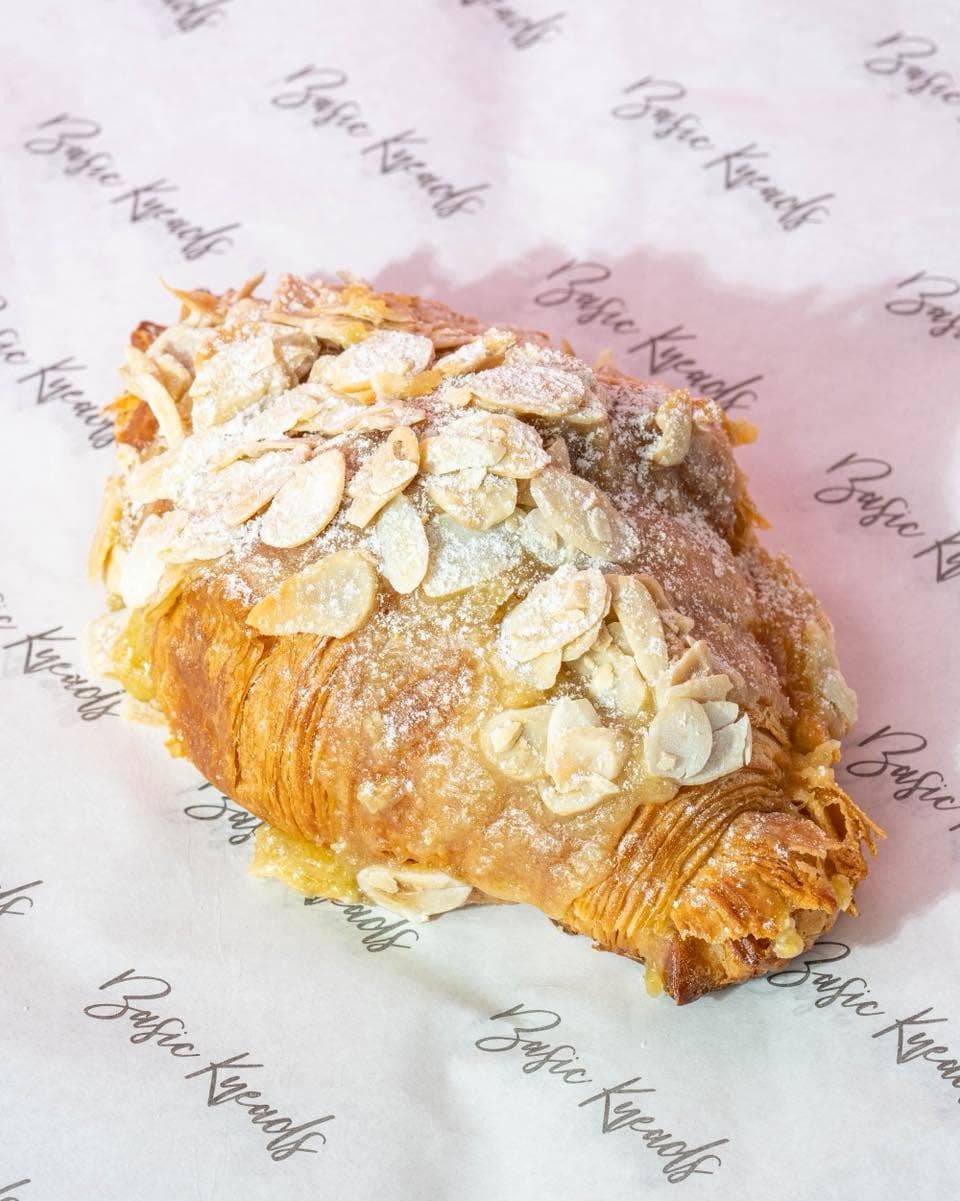 Almond Frangipane croissant on Basic Kneads wrapping paper