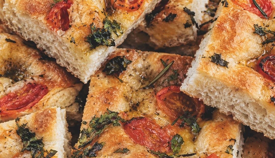 Focaccia squares with tomato and herbs