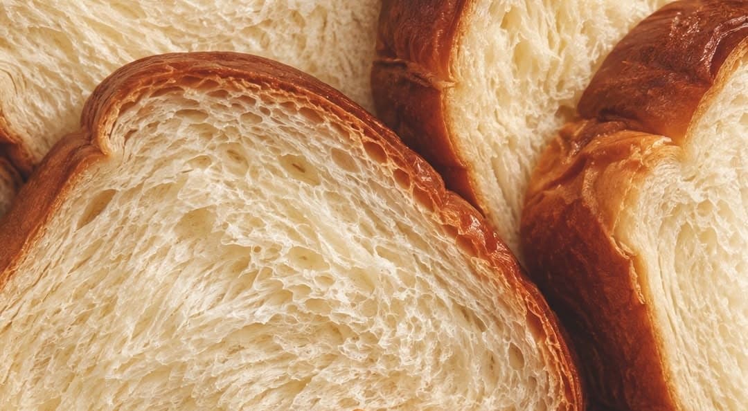 Thick slices of shokupan, close enough to see the crumb
